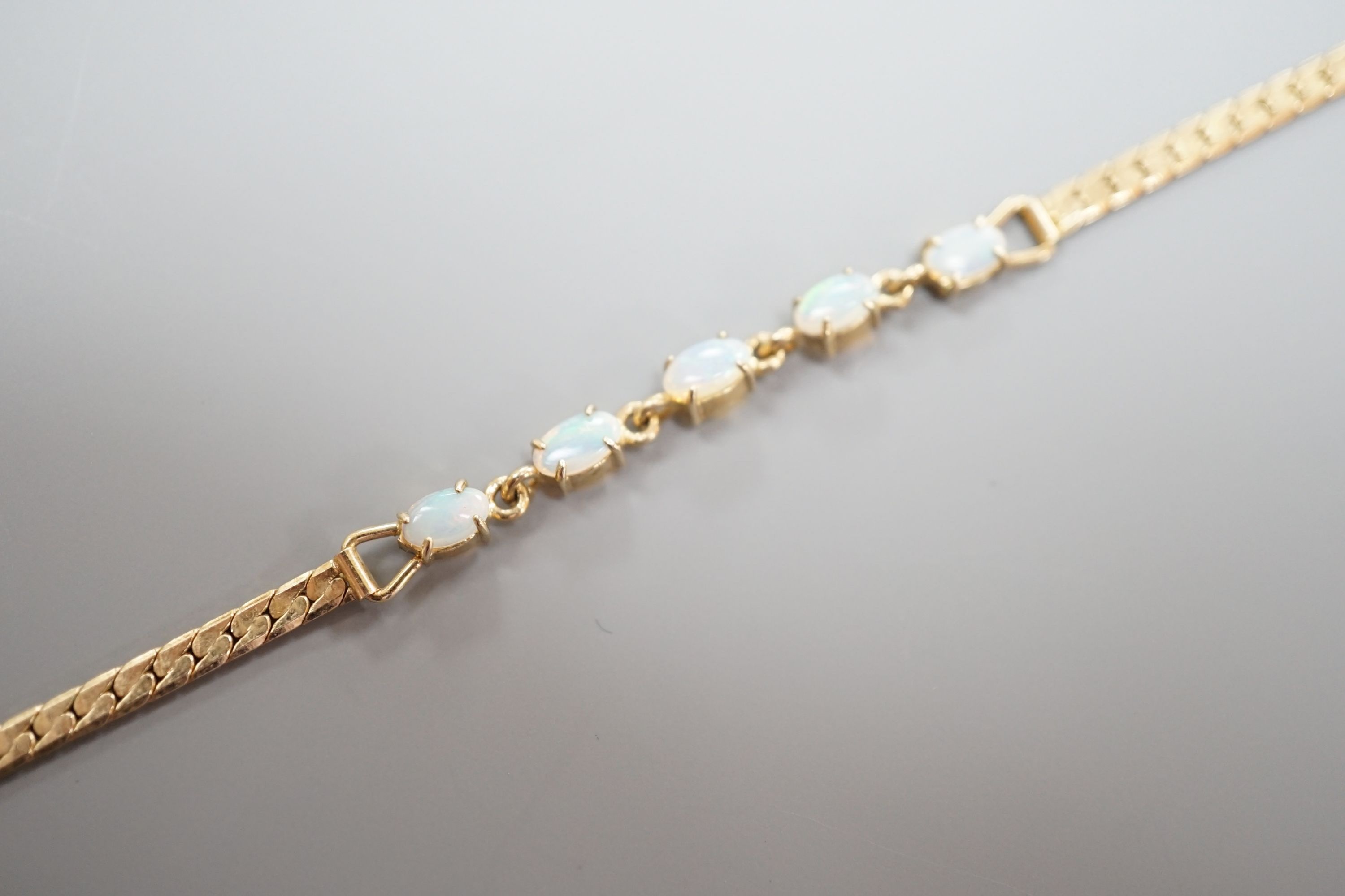 A modern gilt metal and five stone oval white opal set bracelet, 16.5cm.